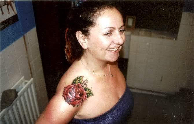 Mrs Carlos and her tattoos.she has a matching one on the other shoulder.