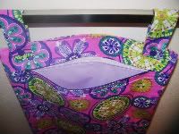 Carnival Blooms in purple hanging mama cloth wetbag