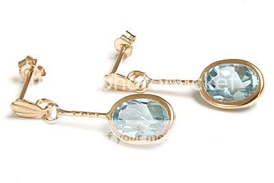 Brand new 9ct gold earrings set with natural Blue Topaz gemstones