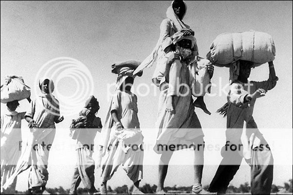 Old-sikh-man-carrying-wife1947_zpsafe9830c.jpg
